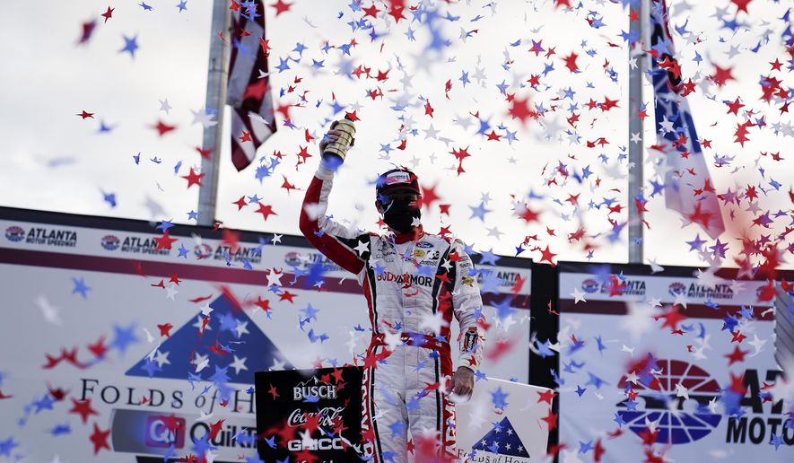 Ryan Blaney celebrates his win after a NASCAR Cup Series auto race at Atlanta Motor Speedway on Sunday, March 21, 2021, in Hampton, Ga. (AP Photo/Brynn Anderson)