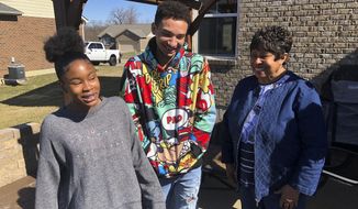 Brilee Carter, left,13, and Cobe Calhoun, 17, share a laugh with their great-grandmother, Doris Rolark, outside Rolark&#39;s daughter&#39;s home on March 7, 2021, in Monroe, Ohio. The pandemic and its isolating restrictions have been especially tough for many of the nation&#39;s some 70 million grandparents, many at ages when they are considered most vulnerable to the deadly COVID-19 virus. Rolark, of Middletown, Ohio, has always been active with the offspring. She raised three children mostly on her own, had five grandchildren (two now deceased), and has helped a lot with some of her 16 great-grandchildren. (AP Photo/Dan Sewell)