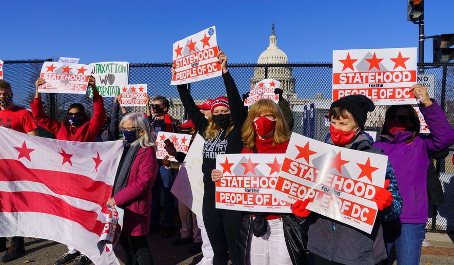 Advocates for statehood for the District of Columbia rally near the Capitol prior to a House of Representatives hearing on creating a 51 state, in Washington, Monday, March 22, 2021. (Associated Press) **FILE**