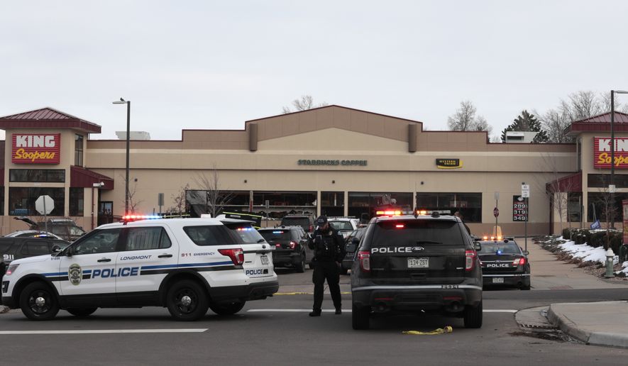 Police work on the scene outside of a King Soopers grocery store where a shooting took place Monday, March 22, 2021, in Boulder, Colo. (AP Photo/Joe Mahoney)