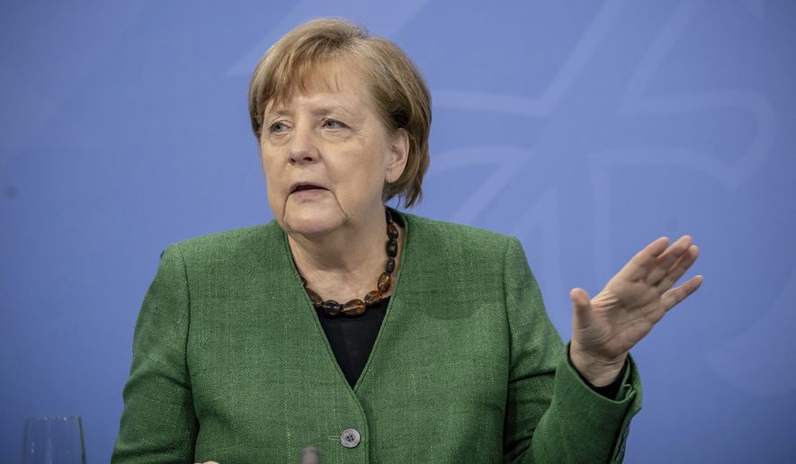 German Chancellor Angela Merkel gestures during a press conference in the Chancellor&#x27;s Office following consultations between the federal and state governments in Berlin Tuesday, March 23, 2021. Germany extended its lockdown measures by another month and imposed several new restrictions, including largely shutting down public life over Easter, in an effort to drive down the rate of coronavirus infections. (Michael Kappeler/Pool Photo via AP)