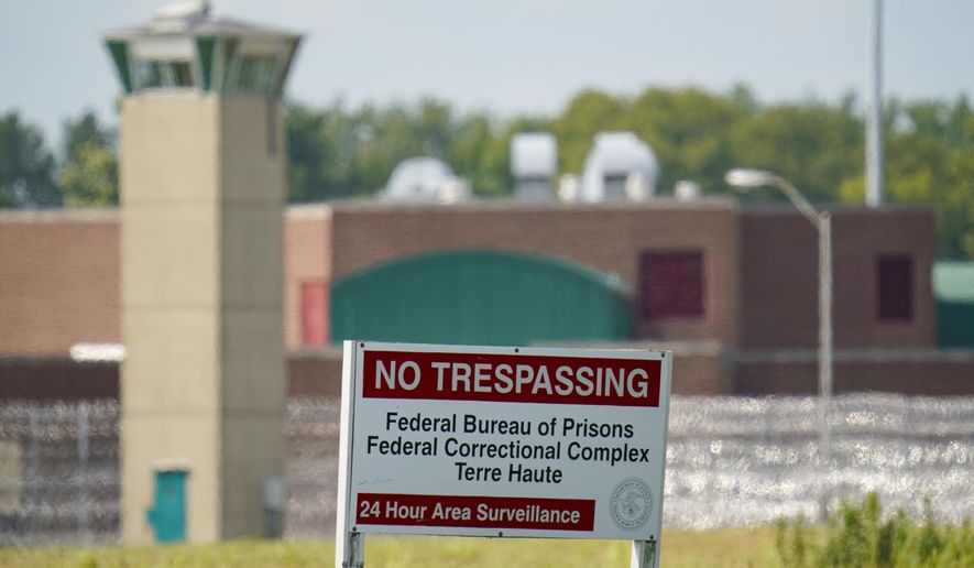 This Aug. 26, 2020, file photo shows the federal prison complex in Terre Haute, Ind. Inmates on federal death row tell The Associated Press that a leading topic of conversation through airducts they use to communicate is whether President Joe Biden will keep a campaign pledge to halt federal executions. Biden hasn’t spoken publicly to that question since taking office four days after the Trump administration executed the last of 13 inmates at the Terre Haute prison where federal death row is located. (AP Photo/Michael Conroy, File)