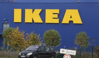 FILE - In this Nov. 20, 2013 file photo, a car drives past the IKEA store in Plaisir, west of Paris. Ikea&#39;s French subsidiary and several of its executives are set to go on trial Monday over accusations that they illegally spied on employees and customers. Trade unions reported the furniture and home goods company to French authorities in 2012, accusing it of collecting personal data by fraudulent means and the illicit disclosure of personal information. (AP Photo/Remy de la Mauviniere, File)