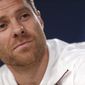 FILE - In this April 17, 2017 file photo, Bayern Munich&#39;s Xabi Alonso listens to a question during a news conference at the Santiago Bernabeu stadium in Madrid, Spain. German media reports say that former Spain midfielder Xabi Alonso is to take over at Borussia Moenchengladbach coach next season. The tabloid Bild and its sister magazine Sport Bild first reported that the 39-year-old Alonso has agreed to take over from current Gladbach coach Marco Rose, who is joining Borussia Dortmund next season. (AP Photo/Francisco Seco, File)