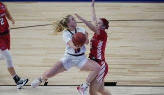 Louisville guard Hailey Van Lith (10) drives to the basket against Marist guard Anabel Ellison (22) during the first half of a college basketball game in the first round of the women&#39;s NCAA tournament at the Alamodome in San Antonio, Monday, March 22, 2021. (AP Photo/Eric Gay)