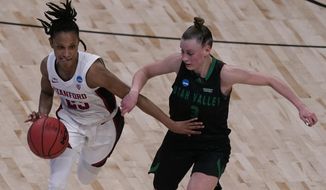 Stanford guard Kiana Williams drives under pressure from Utah Valley guard Maria Carvalho (3) during the second half of a college basketball game in the first round of the women&#39;s NCAA tournament at the Alamodome in San Antonio, Sunday, March 21, 2021. (AP Photo/Charlie Riedel)