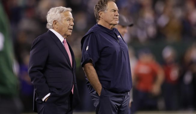 FILE - New England Patriots owner Robert Kraft, left, talks to head coach Bill Belichick as their team warms up before an NFL football game against the New York Jets in East Rutherford, N.J., in this Monday, Oct. 21, 2019, file photo. Belichick never was one to spent wildly in free agency. But after watching Tom Brady celebrate another Super Bowl in another city, Belichick and his boss, Robert Kraft, had seen enough.  (AP Photo/Adam Hunger, File)