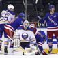New York Rangers&#39; Chris Kreider (20), right, celebrates his second goal of an NHL hockey game in the third period on a power-play against Buffalo Sabres&#39; Dustin Tokarski (31) during an NHL hockey game Monday, March 22, 2021, in New York. (Bruce Bennett/Pool Photo via AP)