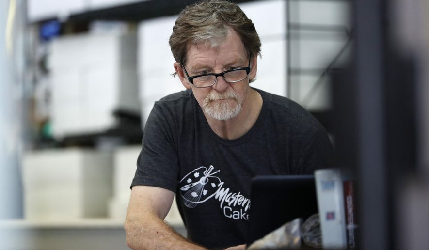 In this Monday, June 4, 2018, file photograph, baker Jack Phillips, owner of Masterpiece Cakeshop, manages his shop in Lakewood, Colo. Baker, who refused to make a wedding cake for a gay couple in 2012 is being sued by a lawyer for declining to make a cake celebrating her gender transition. The U.S. Supreme Court ruled in 2018 the commission showed anti-religious bias when it sanctioned Phillips. The justices did not rule on the larger issue of whether businesses can invoke religious objections to refuse service to gays or lesbians. (AP Photo/David Zalubowski, File)