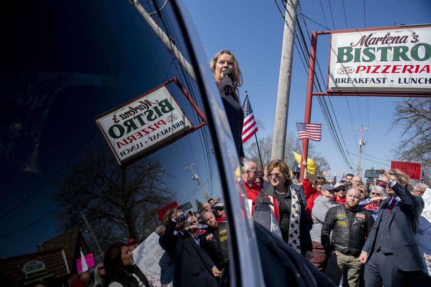 Michigan Republican Party co-chair Meshawn Maddock, speaks as hundreds of people gather in front of on Marlena's Bistro in Holland in support of the owner Marlena Pavlos-Hackney on Saturday March 20, 2021. (Nicole Hester/Mlive.com/Ann Arbor News via AP)