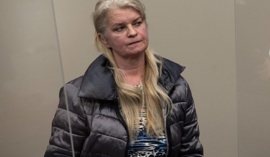 Marlena Pavlos-Hackney sits in the courtroom during her arraignment, Friday March, 19, 2021, at the 30th Judicial Circuit Court in Lansing, Mich. Pavlos-Hackney, a western Michigan restaurant owner, was arrested before dawn Friday and hauled to jail, a dramatic turn in a monthslong dispute over her persistent refusal to comply with orders and restrictions tied to the coronavirus. Pavlos-Hackney, 55, will remain in jail until she pays $7,500 and authorities confirm that Marlena’s Bistro and Pizzeria in Holland, Mich., is closed, a judge said. (Nicole Hester/Ann Arbor News via AP)