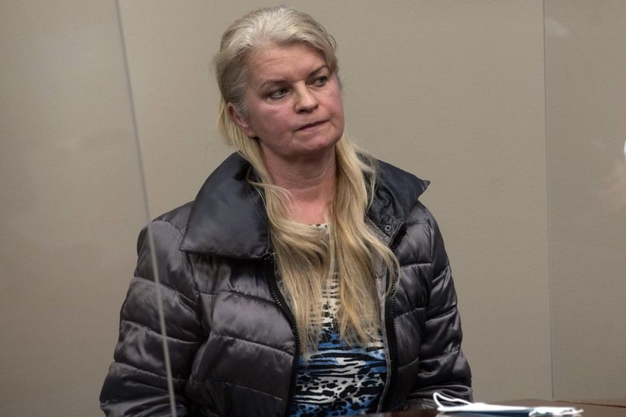 Marlena Pavlos-Hackney sits in the courtroom during her arraignment, Friday March, 19, 2021, at the 30th Judicial Circuit Court in Lansing, Mich. Pavlos-Hackney, a western Michigan restaurant owner, was arrested before dawn Friday and hauled to jail, a dramatic turn in a monthslong dispute over her persistent refusal to comply with orders and restrictions tied to the coronavirus. Pavlos-Hackney, 55, will remain in jail until she pays $7,500 and authorities confirm that Marlena’s Bistro and Pizzeria in Holland, Mich., is closed, a judge said. (Nicole Hester/Ann Arbor News via AP)