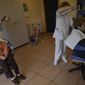 90 Maribel Elizondo, left, sits as 84 year old Luisa Tollar, has her hair set by hair dresser Gloria Cerdan in the hairdressers at Ibaneta nursing home, in the small village of Erro, around 30 kms (18 miles) from Pamplona, northern Spain, Monday, March 22, 2021. Every week, on Monday, hairdresser Gloria Cerdan attends to residents at the nursing home. (AP Photo/Alvaro Barrientos)