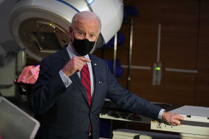 President Joe Biden speaks during a tour of the James Cancer Hospital and Solove Research Institute, Tuesday on the campus of The Ohio State University Tuesday, March 23, 2021, in Columbus, Ohio. (AP Photo/Evan Vucci)