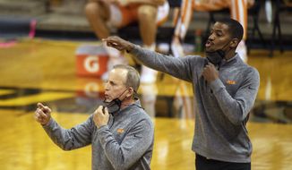 Tennessee head coach Rick Barnes, left, and assistant coach Kim English, right, position their players during the first half of an NCAA college basketball game against Missouri in Columbia, Mo., in this Wednesday, Dec. 30, 2020, file photo. Former NBA player and college assistant Kim English was hired to coach George Mason&#39;s men&#39;s basketball team Tuesday, March 23, 2021, exactly a week after the school fired Dave Paulsen.(AP Photo/L.G. Patterson, File) **FILE**