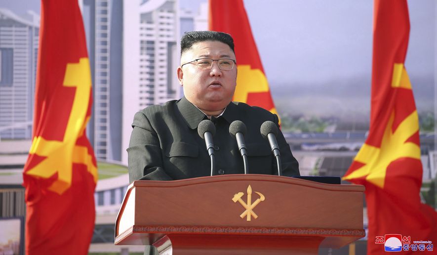 In this photo provided by the North Korean government, North Korean leader Kim Jong-un speaks during a ceremony to break ground for building 10,000 homes, in Pyongyang, North Korea, Tuesday, March 23, 2021. The content of this image is as provided and cannot be independently verified. Korean language watermark on image as provided by source reads: &quot;KCNA&quot; which is the abbreviation for Korean Central News Agency. (Korean Central News Agency/Korea News Service via AP) ** FILE **