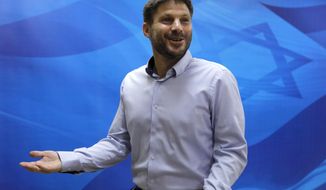 FILE - In this June 24, 2019, file photo, Bezalel Smotrich, the then Israeli transportation minister, arrives to attend a weekly cabinet meeting in Jerusalem. An alliance of far-right groups including openly racist and homophobic candidates like Smotrich appears poised to enter Israel’s parliament, possibly as an indispensable member of Prime Minister Benjamin Netanyahu’s right-wing coalition, according to exit polls Tuesday, March 23, 2021. Smotrich, a longtime activist, has organized anti-gay protests and recently compared gay marriage to incest. (Menahem Kahana/Pool via AP, File)