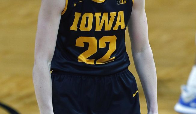 Iowa guard Caitlin Clark (22) react after hitting a three during the first half of a college basketball game in the second round of the women&#x27;s NCAA tournament at the Greehey Arena in San Antonio, Texas, Tuesday, March 23, 2021. (AP Photo/Ronald Cortes)