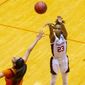 Stanford guard Kiana Williams (23) scores over Oklahoma State guard Neferatali Notoa during the second half of a college basketball game in the second round of the NCAA women&#39;s tournament at the UTSA Convocation Center in San Antonio on Tuesday, March 23, 2021. (AP Photo/Stephen Spillman)
