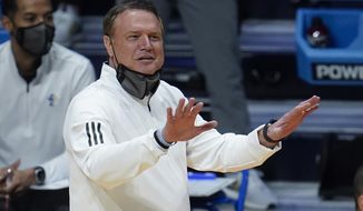 Kansas head coach Bill Self signals against USC during the first half of a men&#39;s college basketball game in the second round of the NCAA tournament at Hinkle Fieldhouse in Indianapolis, Monday, March 22, 2021. (AP Photo/Paul Sancya)