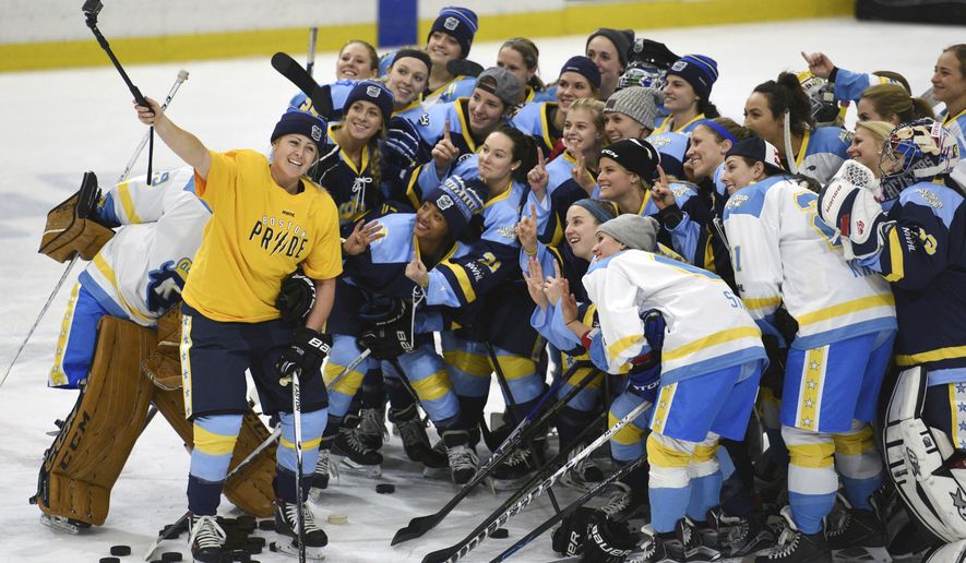 FILE - In this Sunday, Jan. 24, 2016, file photo, National Women's Hockey League All-Star players take time for a "selfie" before an all-star game at Harborcenter in Buffalo, N.Y. The National Women’s Hockey League is adding a seventh team by expanding into Montreal next season, two people with direct knowledge of the league’s board of governors’ approved plan told The Associated Press. The people spoke to The AP on the condition of anonymity because they are not authorized to speak for the NWHL. League spokesman, Paul Krotz, would only say the NWHL had "nothing to report regarding season seven expansion,” in an email sent late Monday, March 22, 2021. (AP Photo/Gary Wiepert, File)