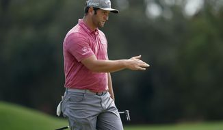 Jon Rahm, of Spain, reacts after missing a putt on the first hole during the final round of The Players Championship golf tournament Sunday, March 14, 2021, in Ponte Vedra Beach, Fla. (AP Photo/Gerald Herbert)