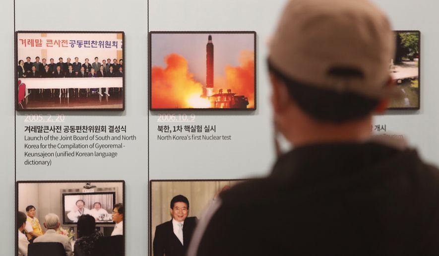 A photo showing North Korea&#39;s missile launch is displayed at the Unification Observation Post in Paju, near the border with North Korea, South Korea, Wednesday, March 24, 2021. North Korea fired short-range missiles this past weekend, just days after the sister of Kim Jong Un threatened the United States and South Korea for holding joint military exercises. (AP Photo/Ahn Young-joon)