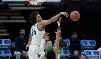 Villanova&#39;s Jeremiah Robinson-Earl (24) blocks the shot of North Texas&#39; James Reese (0) during the first half of a second-round game in the NCAA men&#39;s college basketball tournament at Bankers Life Fieldhouse, Sunday, March 21, 2021, in Indianapolis. There was a notion that Villanova was kind of an afterthought in the NCAA Tournament, even with a five seed and all that experience. It’s hard to think of Villanova as needing a chip on its shoulder, but it&#39;s got one. They’ll need it against No. 1 Baylor. (AP Photo/Darron Cummings)