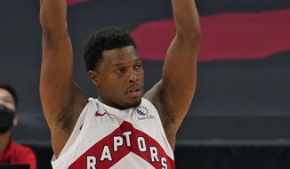 Toronto Raptors guard Kyle Lowry (7) celebrates a three-point basket during the second half of an NBA basketball game against the Denver Nuggets Wednesday, March 24, 2021, in Tampa, Fla. (AP Photo/Chris O&#39;Meara)