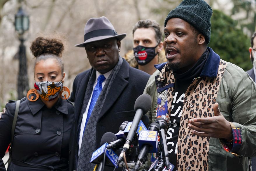 Keyon Harrold Sr., left, is joined by attorney Ben Crump, center, and Katty Rodriguez as he speaks to reporters during a news conference to announce the filing of a lawsuit against Arlo Hotels and Miya Ponsetto, Wednesday, March 24, 2021, in New York. Keyon Harrold and his son were allegedly racially profiled in an Arlo hotel in Manhattan by Miya Ponsetto in December 2020. Ponsetto wrongly accused Keyon Harrold Jr. of stealing her phone and physically attacking him. (AP Photo/Mary Altaffer)
