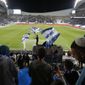 Israeli fans cheer before the World Cup 2022 group F qualifying soccer match between Israel and Denmark in Tel Aviv, Israel, Thursday, March 25, 2021. (AP Photo/Ariel Schalit)