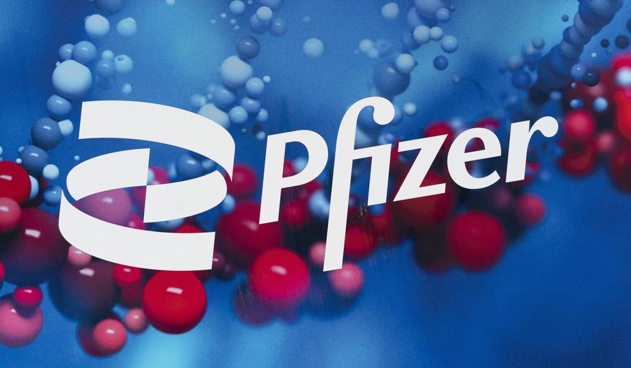 This Friday, Feb. 5, 2021 photo shows the Pfizer logo displayed at the company's headquarters in New York. On Thursday, March 25, 2021, a panel of U.S. health advisers says Pfizer’s tanezumab, an experimental arthritis pain drug, is too risky, even with limits on its use. (AP Photo/Mark Lennihan)