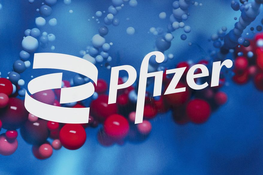 This Friday, Feb. 5, 2021 photo shows the Pfizer logo displayed at the company's headquarters in New York. On Thursday, March 25, 2021, a panel of U.S. health advisers says Pfizer’s tanezumab, an experimental arthritis pain drug, is too risky, even with limits on its use. (AP Photo/Mark Lennihan)