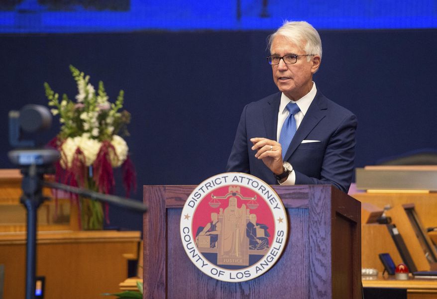 FILE - In this Dec. 7, 2020, file photo provided by the County of Los Angeles, George Gascón speaks after he was sworn in as Los Angeles district attorney in Los Angeles. Minutes after Gascón was sworn in, he fulfilled a promise to institute sweeping criminal justice reform, sending a lengthy memo ordering prosecutors to stop seeking longer prison sentences, among other changes. To many of his deputies, it may as well have been a declaration of war. The union representing prosecutors quickly sued their new boss to block the policy. (Bryan Chan/County of Los Angeles via AP, File)