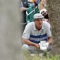 Bryson DeChambeau lines up a shot near the trees on the 16th hole during a first round match at the Dell Technologies Match Play Championship golf tournament Wednesday, March 24, 2021, in Austin, Texas. (AP Photo/David J. Phillip)