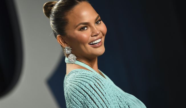 FILE - In this Feb. 9, 2020, file photo, Chrissy Teigen arrives at the Vanity Fair Oscar Party in Beverly Hills, Calif. Teigen has deleted her popular Twitter account, saying the site no longer plays a positive role in her life and has become a negative part on her life. (Photo by Evan Agostini/Invision/AP, File)