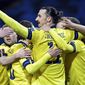 Sweden&#39;s Zlatan Ibrahimovic, center, celebrates scoring his side&#39;s first goal during World Cup 2022 qualifier group A soccer game between Sweden and Georgia at Friends Arena in Stockholm, Thursday March 25, 2021. (Pontus Lundahl/TT News Agency via AP)