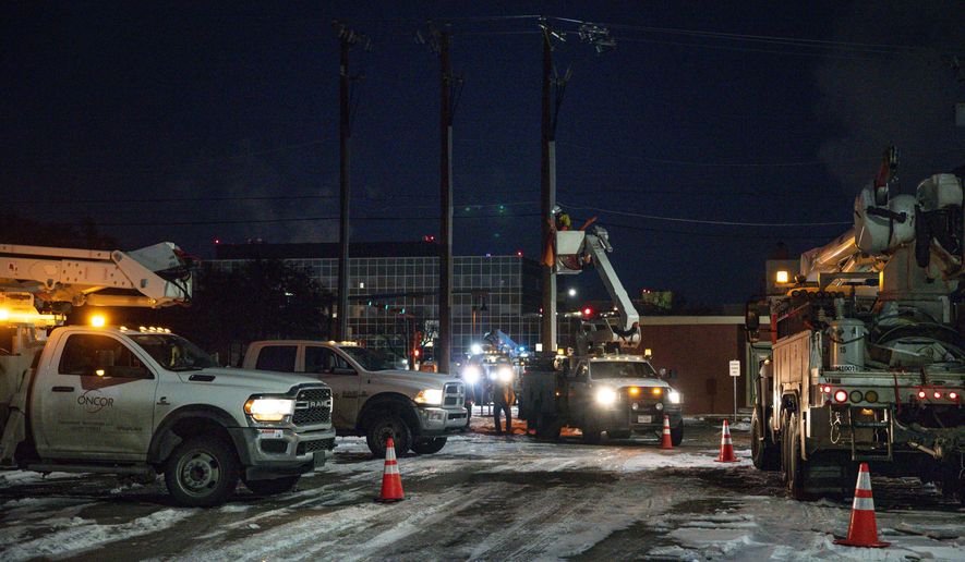 FILE - In this Feb. 18, 2021, file photo, an Oncor Electric Delivery lineman crew works on repairing a utility pole that was damaged by the winter storm that passed through Odessa, Texas. Texas officials on Thursday, March, 25, 2021 raised the death toll from February&#39;s winter storm and blackouts to at least 111 people — nearly doubling the state&#39;s initial tally following one of the worst power outages in U.S. history.. (Eli Hartman/Odessa American via AP, File)