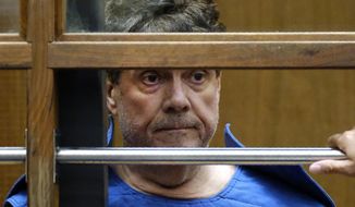 FILE - In this July 1, 2019, file photo, Dr. George Tyndall listens during his arraignment at Los Angeles Superior court in Los Angeles. The University of Southern California has agreed to an $852 million settlement with more than 700 women who have accused Tyndall, the college&#39;s longtime campus gynecologist, of sexual abuse, officials announced Thursday, March 25, 2021. (AP Photo/Richard Vogel, File)