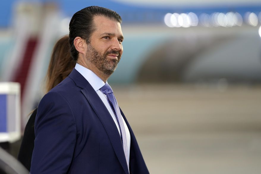 In this Jan. 20, 2021, photo, Donald Trump Jr. waits by Air Force One at Andrews Air Force Base, Md. (AP Photo/Manuel Balce Ceneta) **FILE**