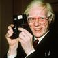 In this 1976 photo, pop artist Andy Warhol smiles in New York. (AP Photo/Richard Drew) **FILE**