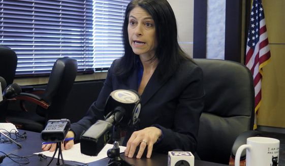 FILE - In this March 5, 2020 file photo, Michigan Attorney General Dana Nessel addresses the media during a news conference in Lansing, Mich. Nessel said Friday, March 26, 2021, that the investigation of Michigan State University&#39;s handling of disgraced sports doctor Larry Nassar is over after the university refused to provide thousands of documents related to the scandal. Nassar was a campus doctor who is serving decades in prison for sexual assault and child pornography crimes, including molesting MSU athletes, U.S. Olympic gymnasts and young elite gymnasts in the Lansing region. (AP Photo/David Eggert, File)