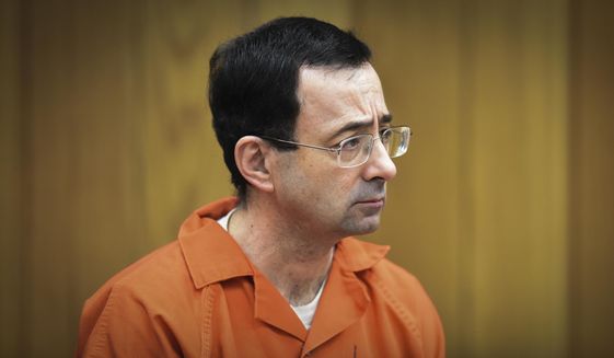 In this Feb. 5, 2018, file photo, Larry Nassar, former sports doctor who admitted molesting some of the nation&#39;s top gymnasts, appears in Eaton County Court in Charlotte, Mich. Attorney General Dana Nessel said Friday, March 26, 2021, that the investigation of Michigan State University&#39;s handling of disgraced sports doctor Nassar is over after the university refused to provide thousands of documents related to the scandal. Nessel&#39;s announcement came after the university said it would not change its position that the documents are protected by attorney-client privilege. (Matthew Dae Smith/Lansing State Journal via AP, File)