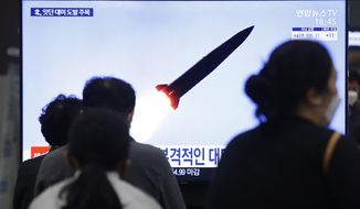 People watch a TV showing a file image of North Korea&#39;s missile launch during a news program at the Suseo Railway Station in Seoul, South Korea, Thursday. March 25, 2021. North Korea on Thursday test-fired its first ballistic missiles since President Joe Biden took office, as it expands its military capabilities and increases pressure on Washington while nuclear negotiations remain stalled. (AP Photo/Ahn Young-joon)