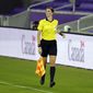 Assistant referee Kathryn Nesbitt runs the sideline as she watches play between Bermuda and Canada during the first half of a World Cup 2022 Group B qualifying soccer match, Thursday, March 25, 2021, in Orlando, Fla. Nesbitt, a 32-year-old from Philadelphia, had a breakthrough moment when she became the first woman to work as an on-field official for a World Cup qualifier in North and Central America and the Caribbean. (AP Photo/John Raoux)