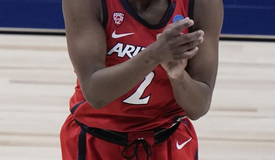 Arizona&#39;s Aari McDonald reacts after making a three-point basket during the the second half of an NCAA college basketball game against Texas A&amp;amp;M in the Sweet 16 round of the Women&#39;s NCAA tournament Saturday, March 27, 2021, at the Alamodome in San Antonio. (AP Photo/Morry Gash)
