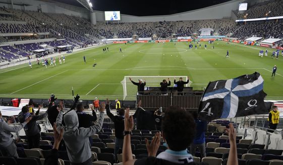 Israelifans cheer before a World Cup 2022 group F qualifying soccer match between Israel and Scotland in Tel Aviv, Israel, Sunday, March 28, 2021. (AP Photo/Ariel Schalit)