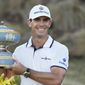 Billy Horschel holds his trophy after winning the Dell Technologies Match Play Championship golf tournament Sunday, March 28, 2021, in Austin, Texas. (AP Photo/David J. Phillip)