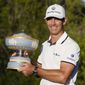 Billy Horschel holds his trophy after winning the Dell Technologies Match Play Championship golf tournament Sunday, March 28, 2021, in Austin, Texas. (AP Photo/David J. Phillip)