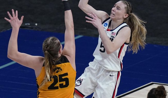 UConn guard Paige Bueckers (5) shoots over Iowa forward Monika Czinano (25) during the second half of a college basketball game in the Sweet Sixteen round of the women&#x27;s NCAA tournament at the Alamodome in San Antonio, Saturday, March 27, 2021. (AP Photo/Eric Gay)